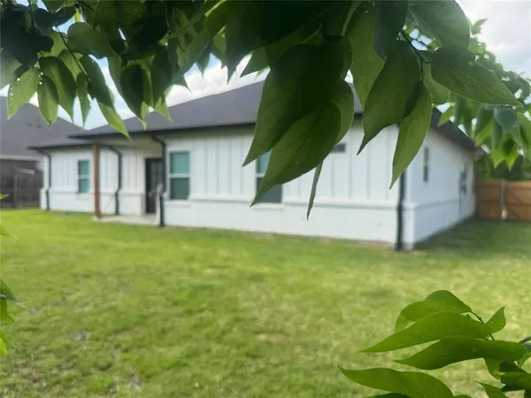 a house view with a garden space