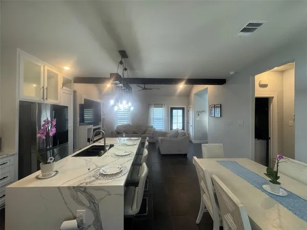 a very nice looking dining room with a table and chairs