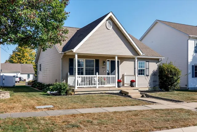 a view of a house with a yard and plants