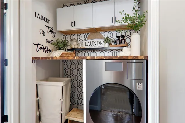 a close view of a utility room with washer and dryer