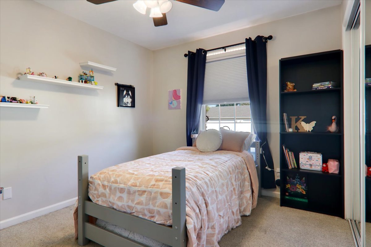 910 Drayton Street Normal, IL 61761 - Photo 13 of 30 a bedroom with a bed and a painting on the wall