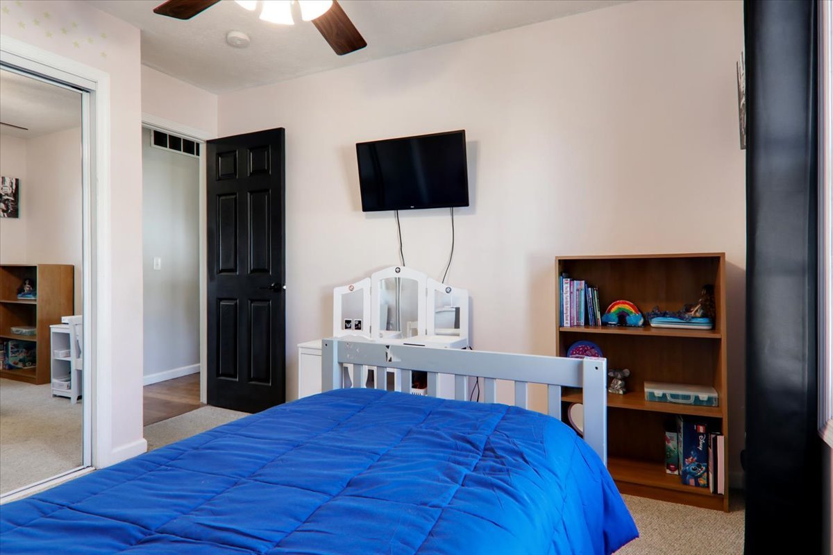 910 Drayton Street Normal, IL 61761 - Photo 16 of 30 a bedroom with a bed and a flat screen tv