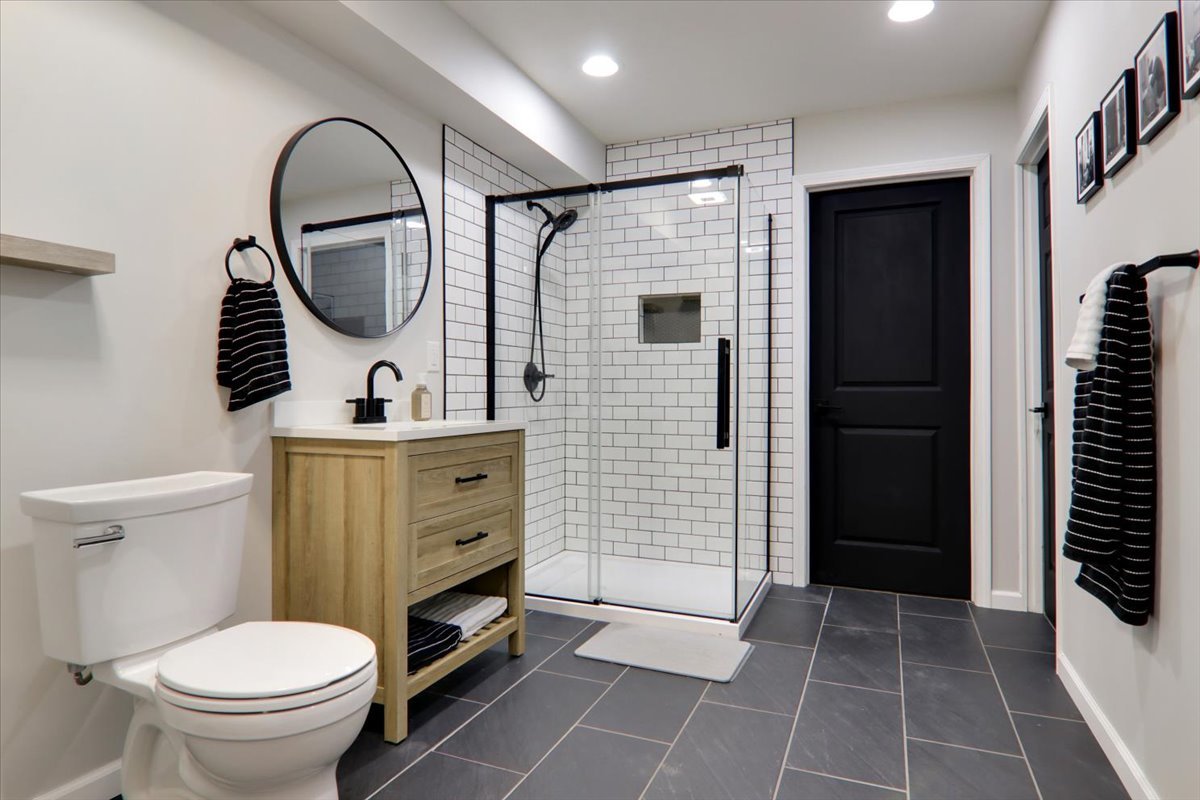 910 Drayton Street Normal, IL 61761 - Photo 21 of 30 a bathroom with a toilet a sink and a mirror