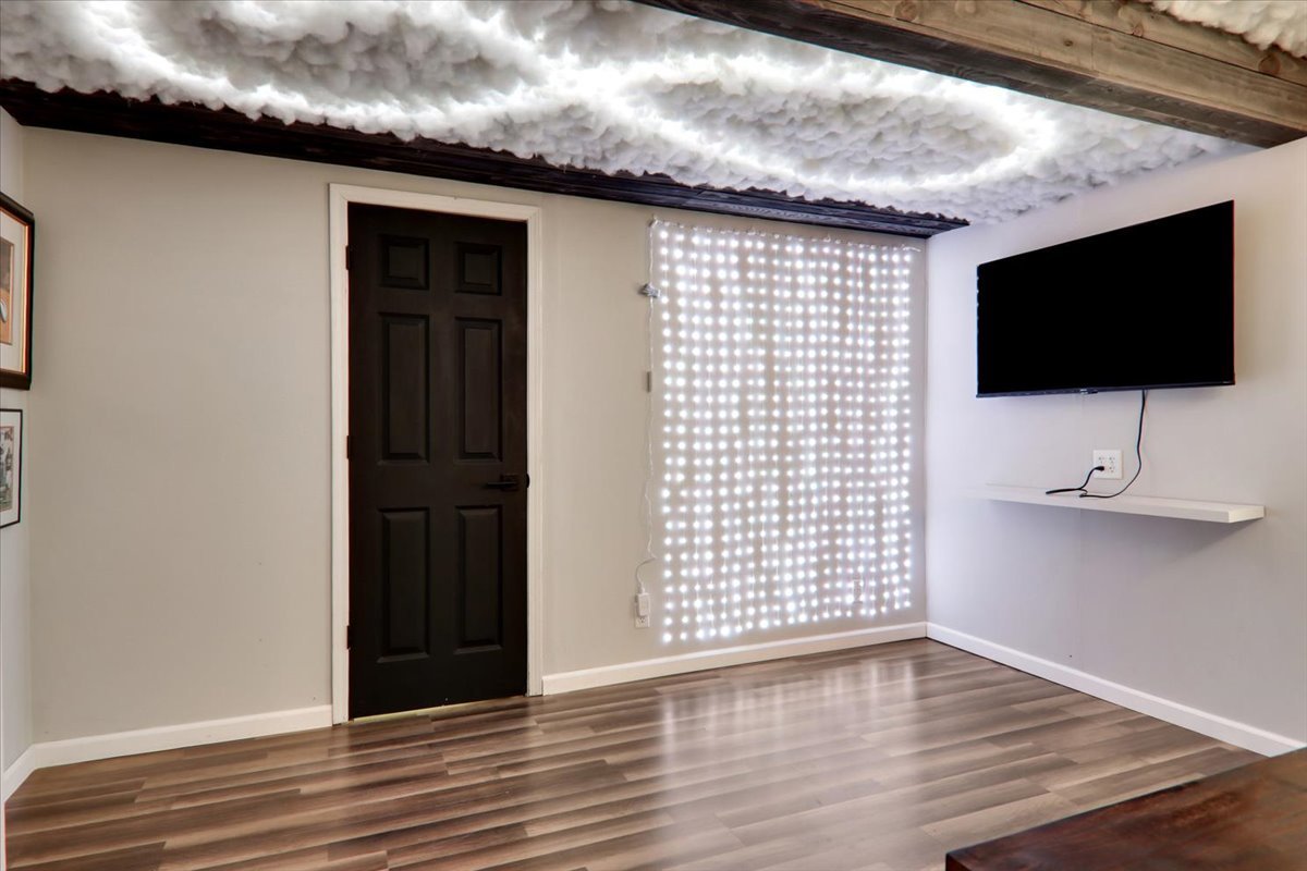 910 Drayton Street Normal, IL 61761 - Photo 25 of 30 a view of a livingroom with wooden floor and a flat screen tv