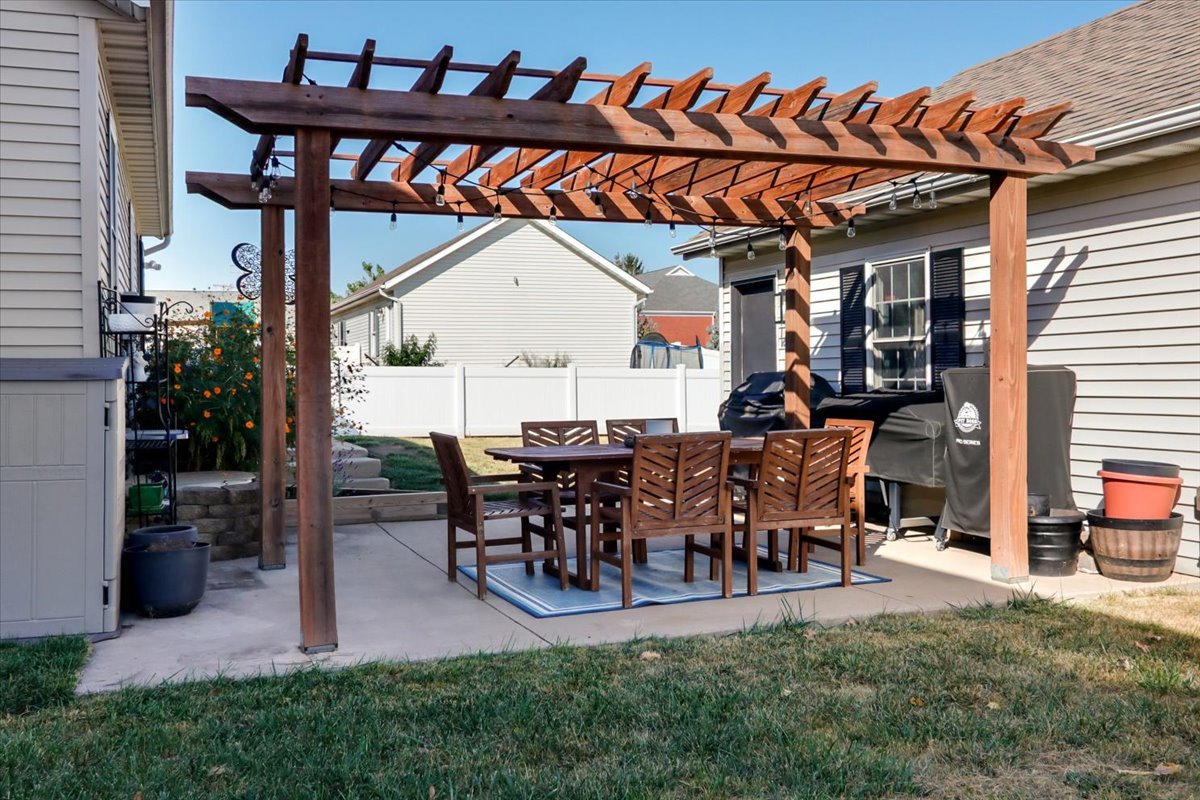 910 Drayton Street Normal, IL 61761 - Photo 30 of 30 a view of a porch with dining table and chairs