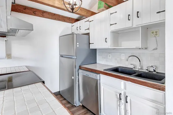 a view of staircase with white walls and a window