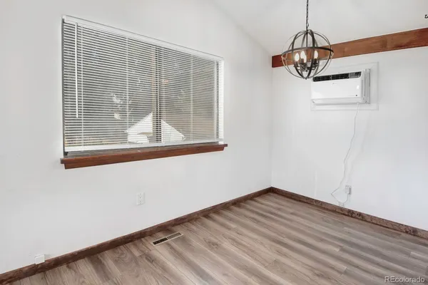 a view of a storage & utility room with a window