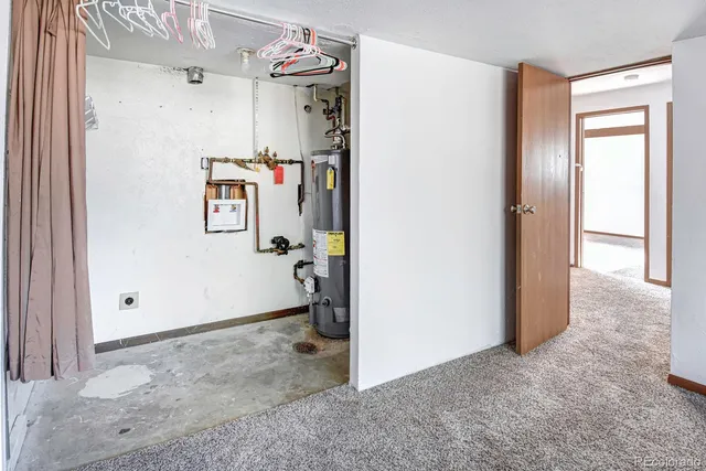 a kitchen with a sink a refrigerator and a stove