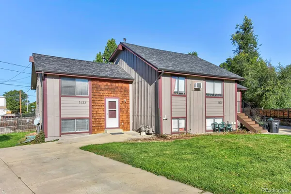 a view of a room with wooden floor and windows