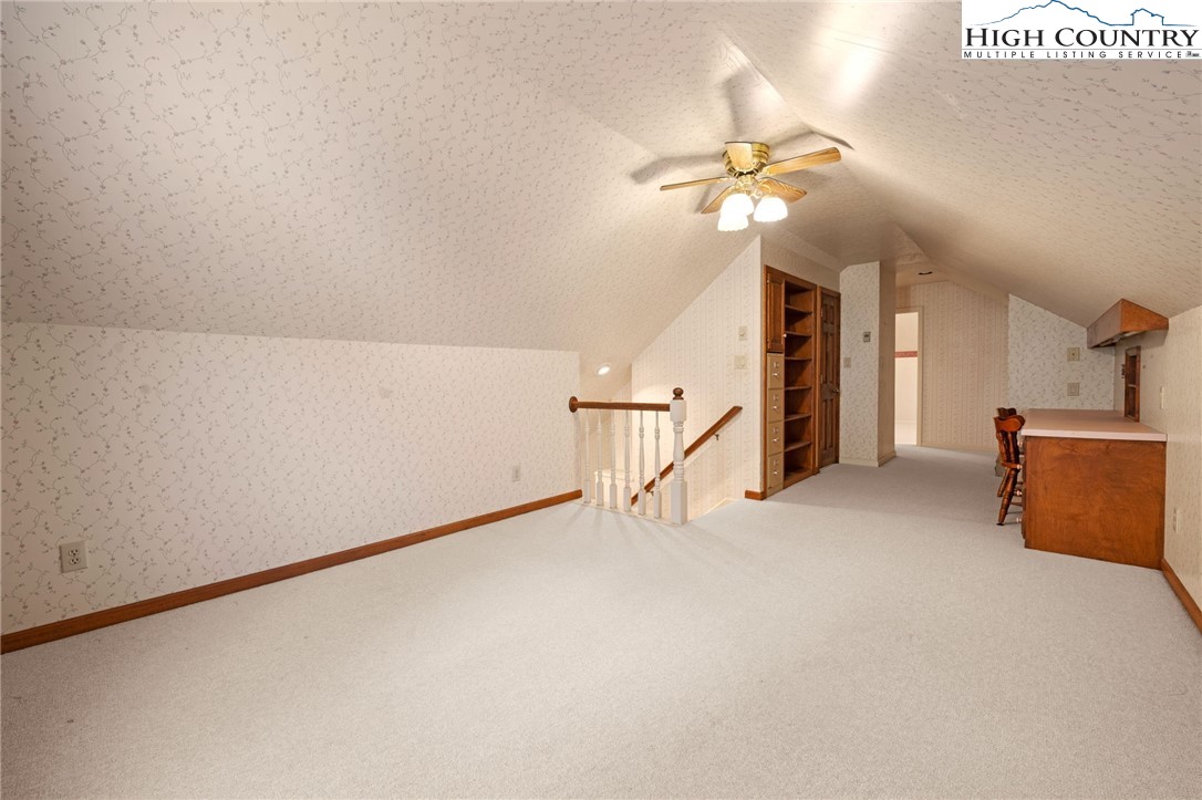 304 Glendale Drive Boone, NC 28607 - Photo 35 of 50 a view of a livingroom with a ceiling fan and a rug