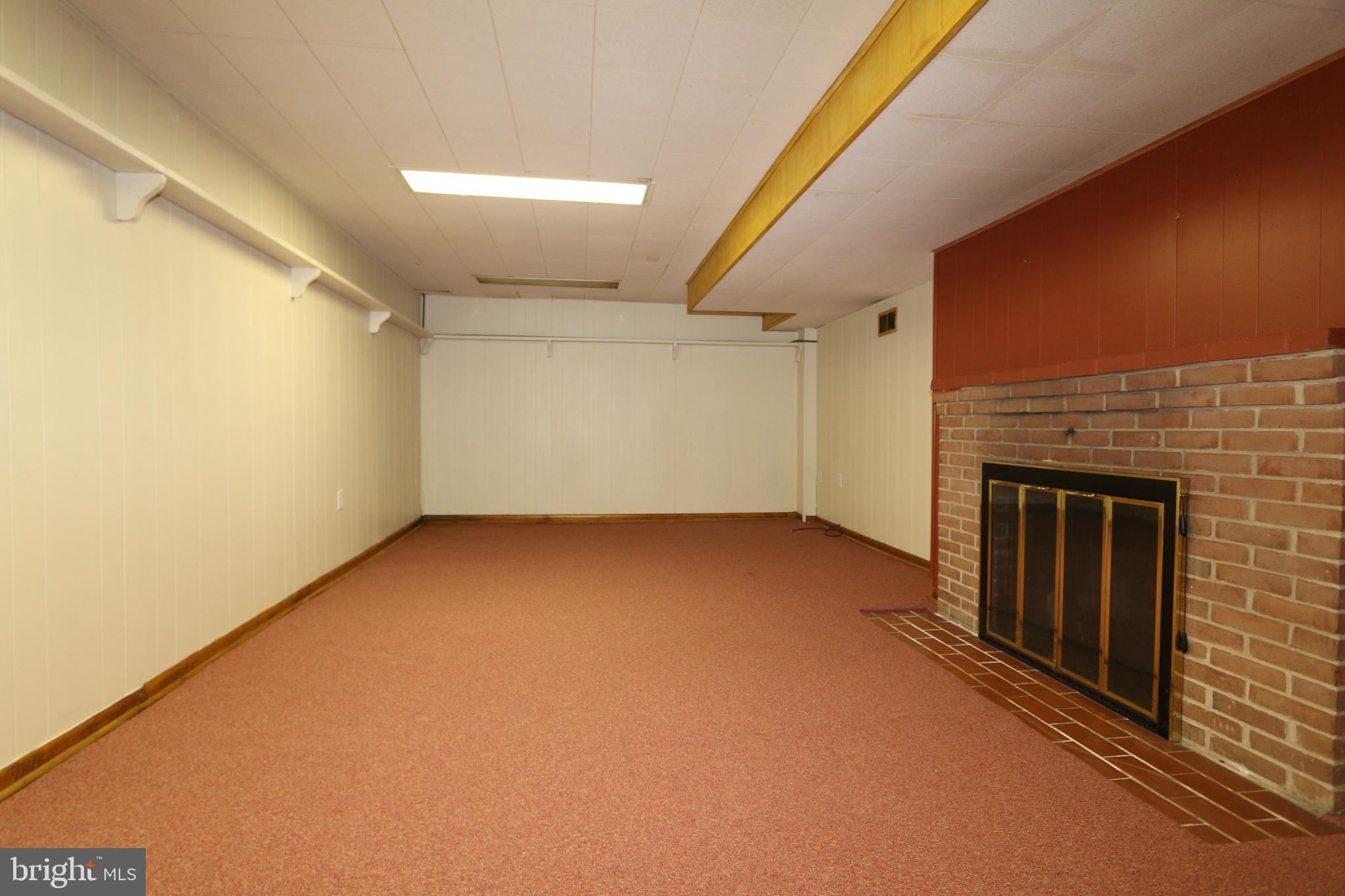 18821 Crofton Road Hagerstown, MD 21742 - Photo 24 of 32 Basement Family Room With Fireplace