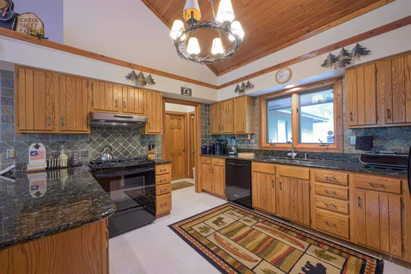 a bathroom with a sink a vanity and a bathtub