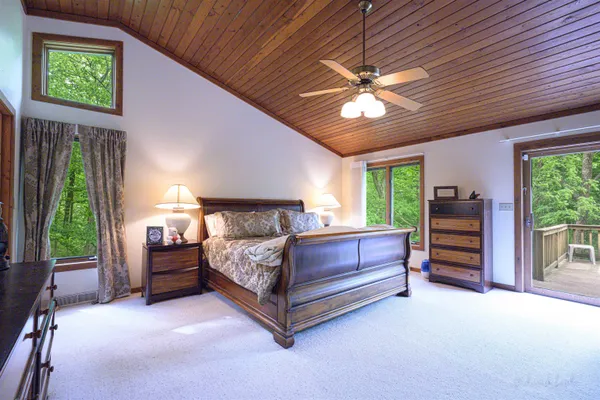 a living room with furniture a rug and a large window