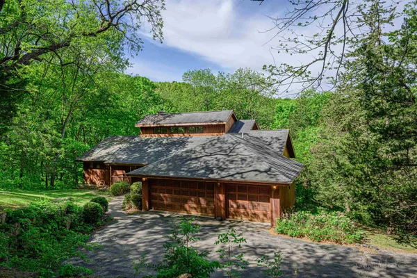 a living room with fireplace furniture and a large window