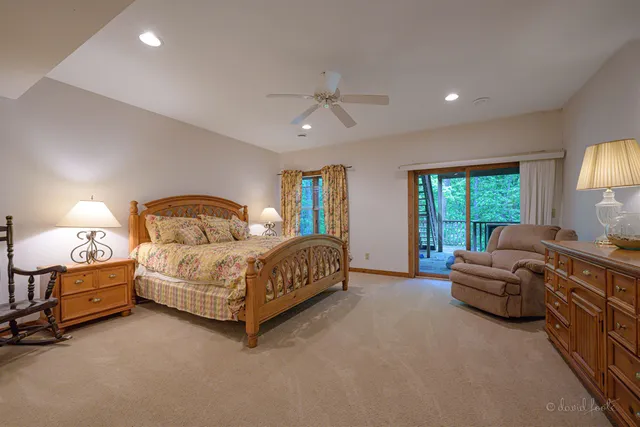 a spacious bedroom with a bed and a couch