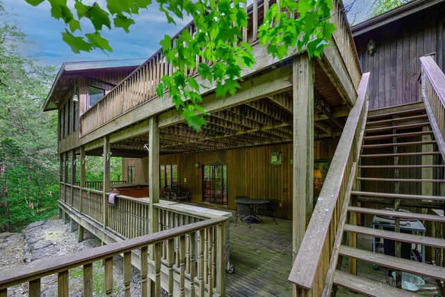 a view of balcony with wooden floor and outdoor seating
