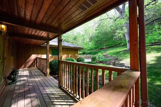 a view of balcony with wooden floor