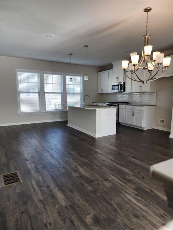 3765 Davis Circle Duluth, GA 30096 - Photo 4 of 8 a view of a kitchen with a dishwasher cabinets and wooden floor