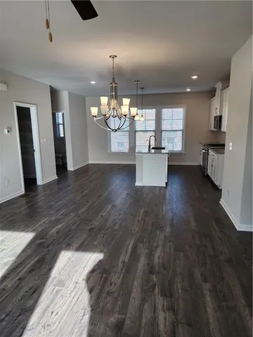 a view of a livingroom with furniture and wooden floor