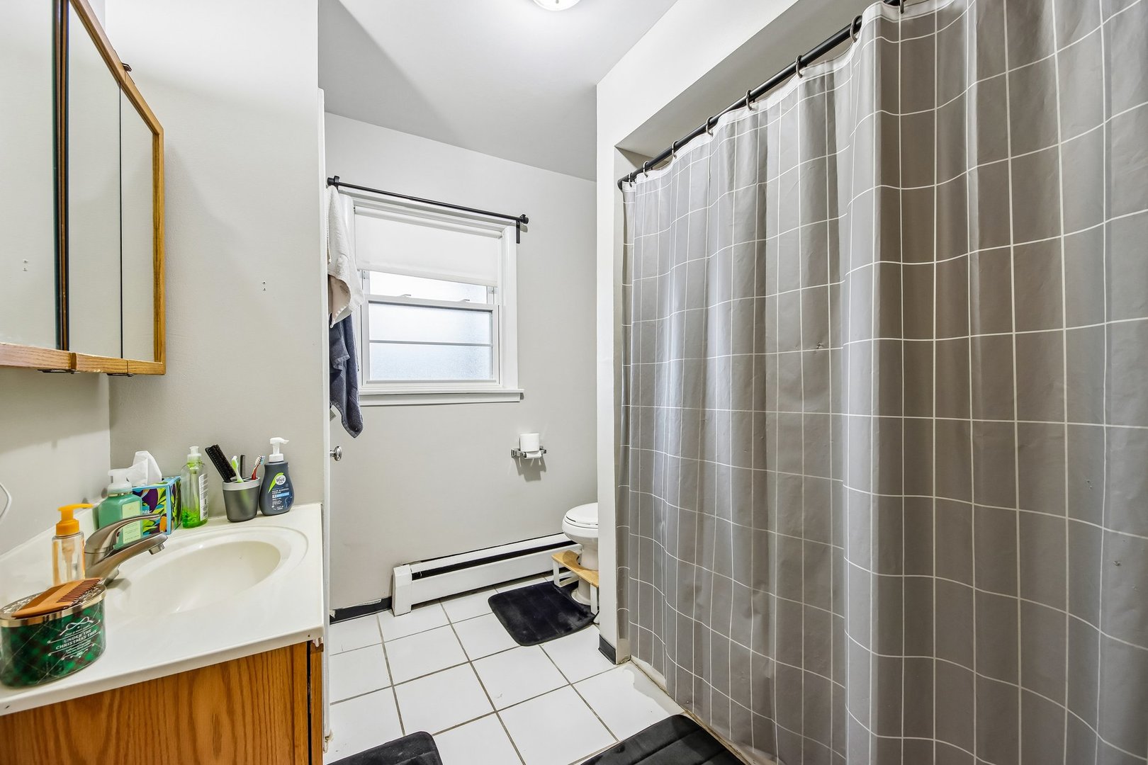 1855 Parkside Drive, Unit 8 Park Ridge, IL 60068 - Photo 16 of 22 a bathroom with a shower and a sink