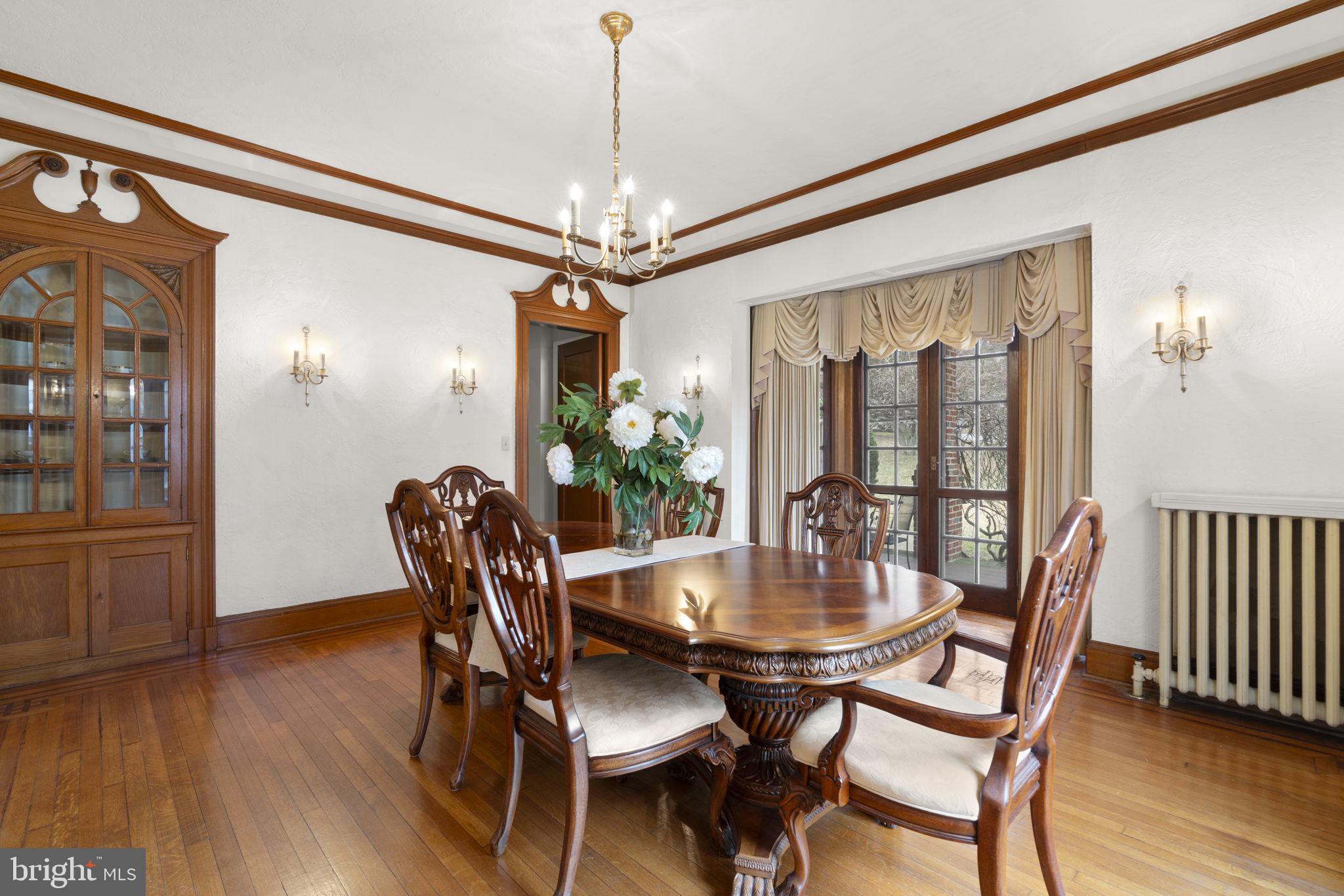 414 Old Orchard Road Baltimore, MD 21229 - Photo 17 of 84 a view of a dining room with furniture window and wooden floor