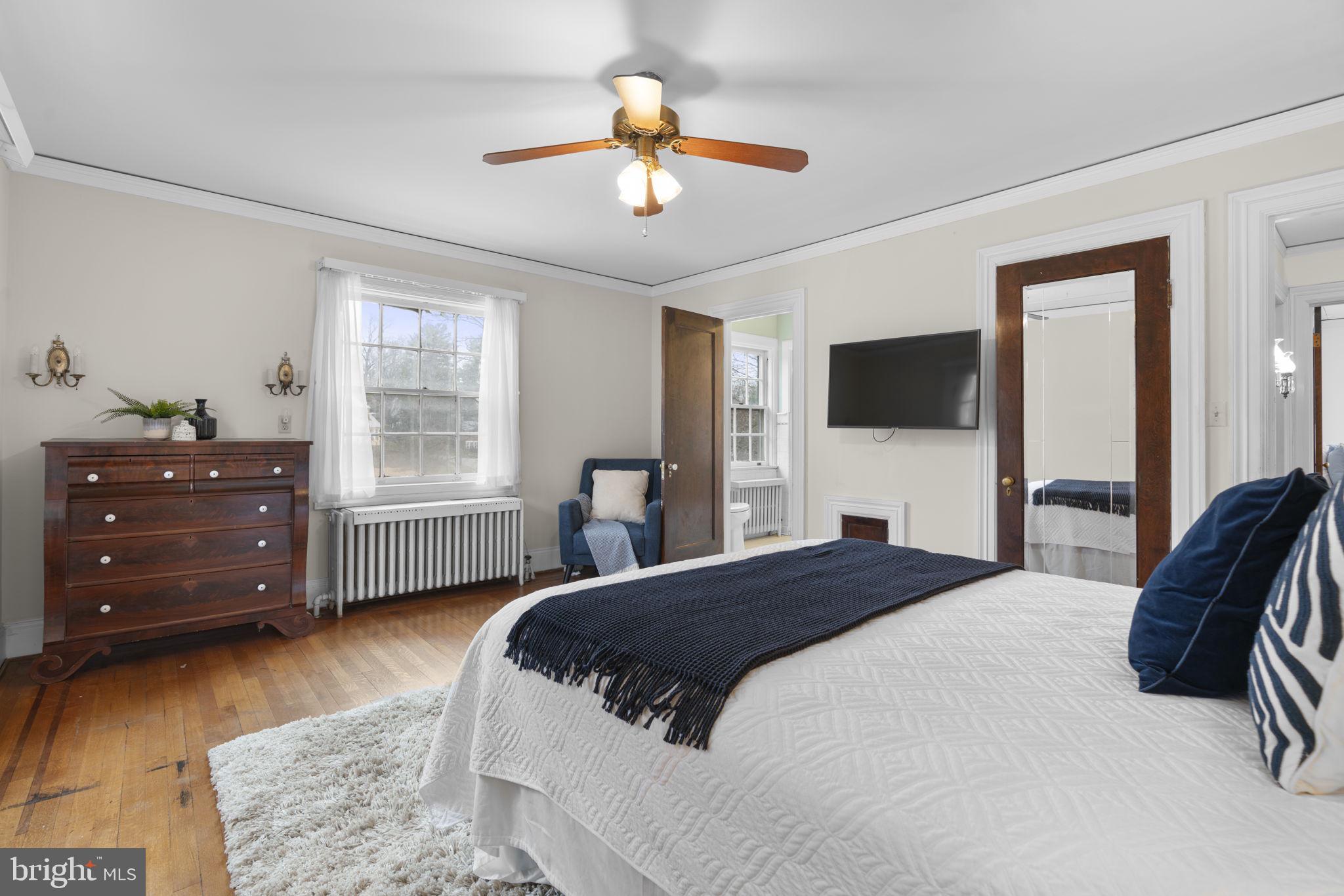 414 Old Orchard Road Baltimore, MD 21229 - Photo 30 of 84 a bedroom with a bed and a dresser