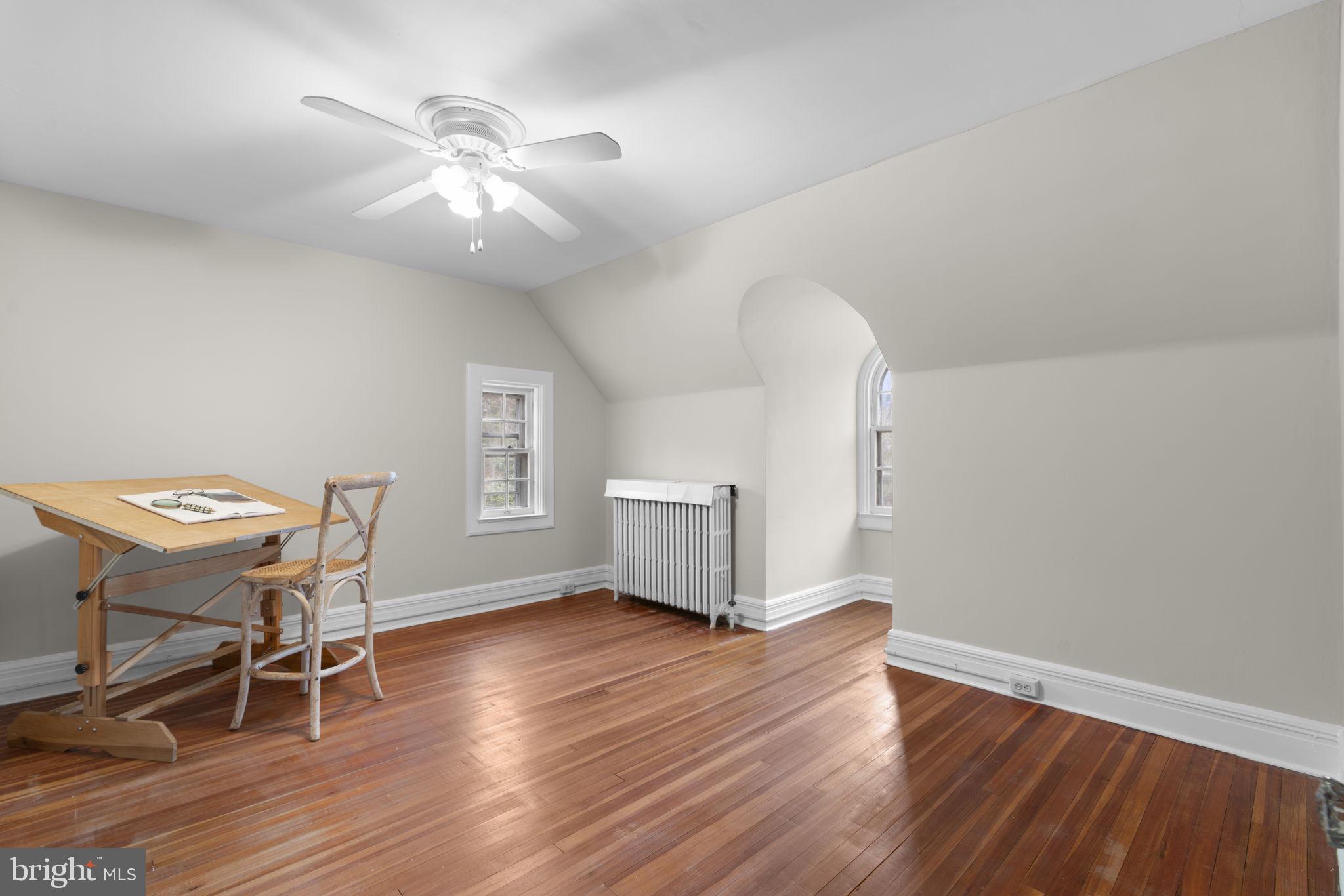 414 Old Orchard Road Baltimore, MD 21229 - Photo 46 of 84 a view of a room with wooden floor lounge chair and windows