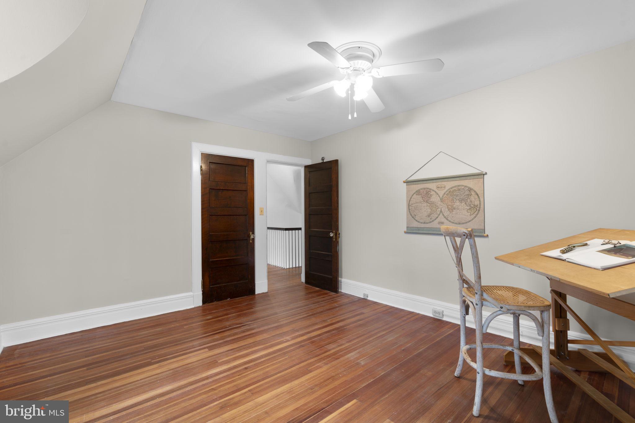 414 Old Orchard Road Baltimore, MD 21229 - Photo 47 of 84 a view of a room with wooden floor and chandelier fan