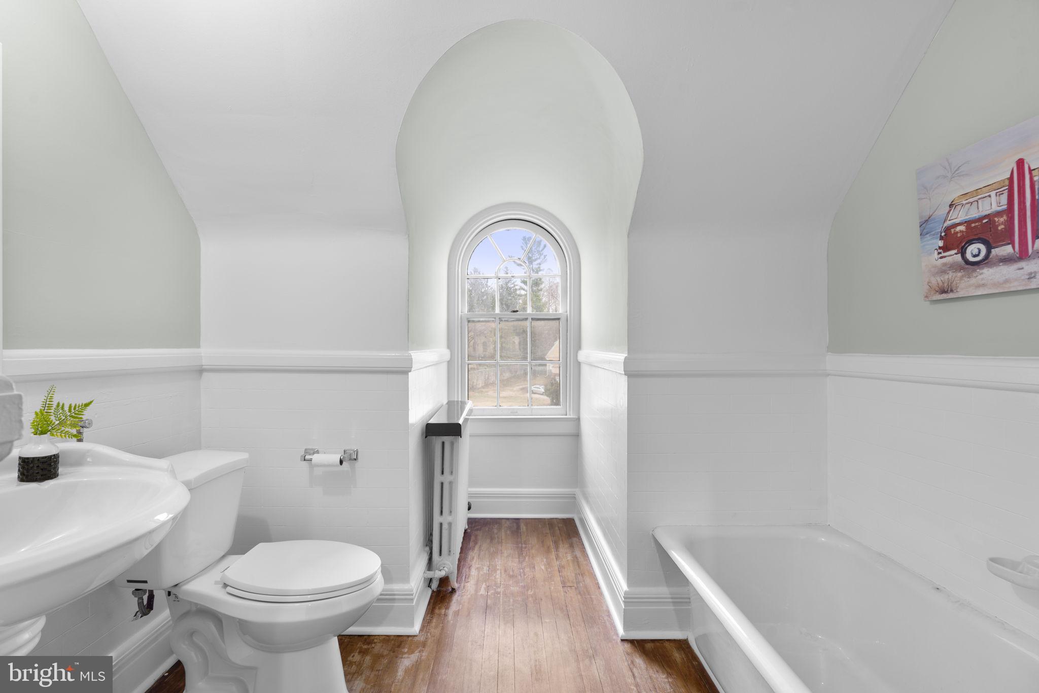 414 Old Orchard Road Baltimore, MD 21229 - Photo 50 of 84 a bathroom with a sink a toilet and a bathtub