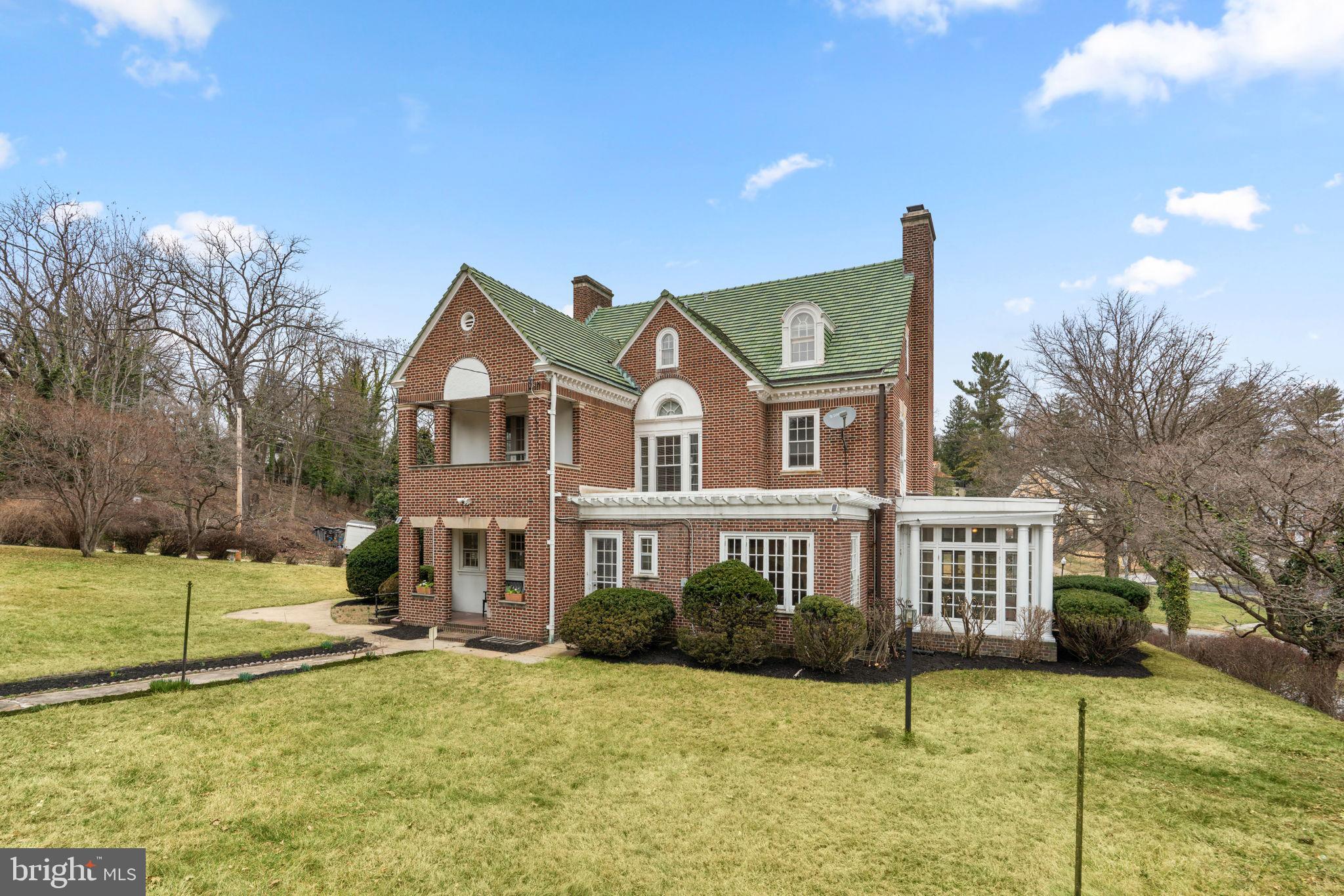 414 Old Orchard Road Baltimore, MD 21229 - Photo 61 of 84 a front view of a house with a yard