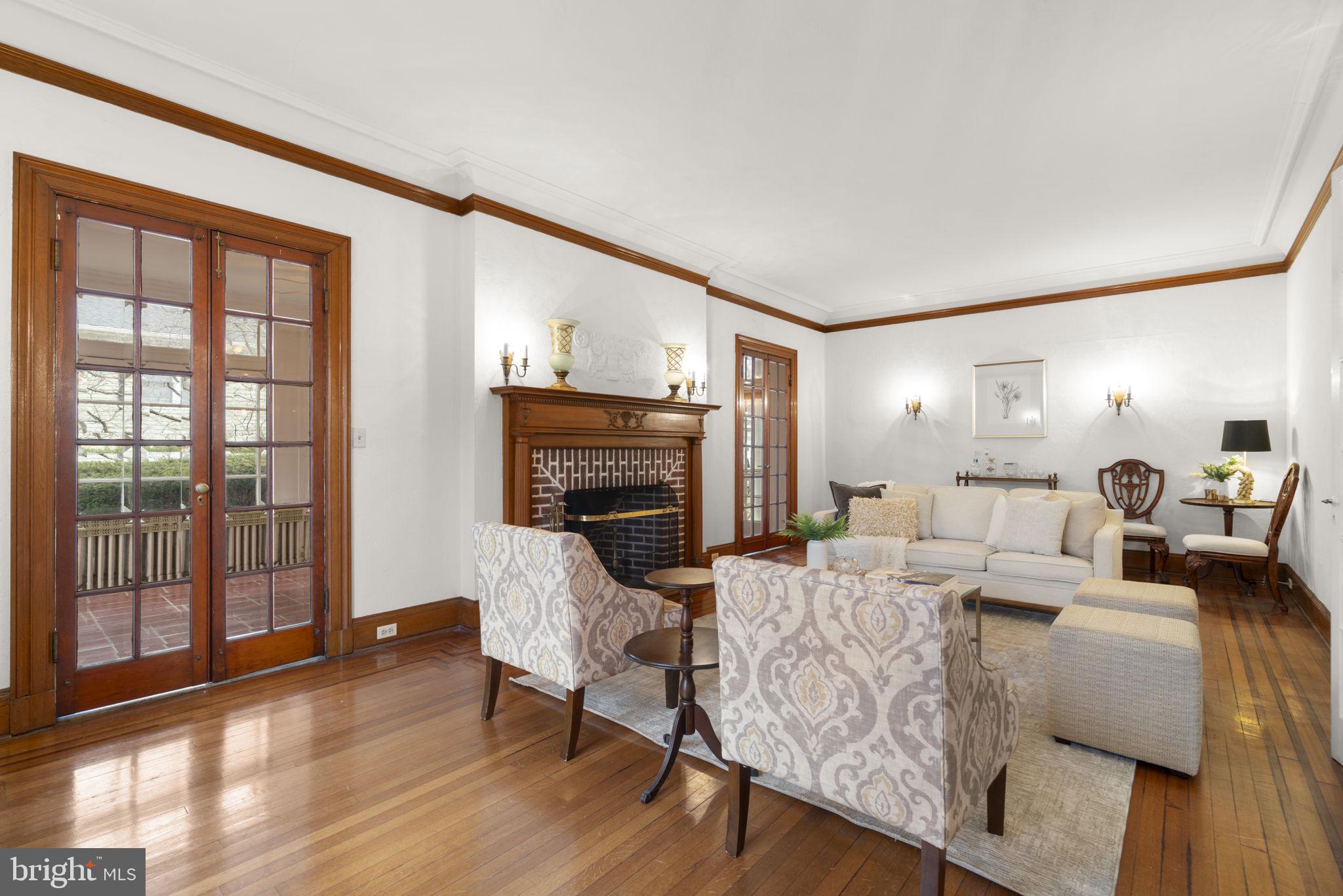 414 Old Orchard Road Baltimore, MD 21229 - Photo 10 of 84 a living room with furniture a fireplace and a large window