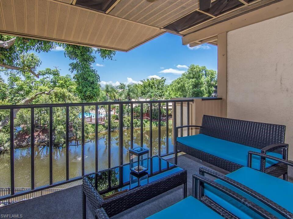 600 Neapolitan Way, Unit 341 Naples, FL 34103 - Photo 17 of 28 a view of a two chairs in the roof deck