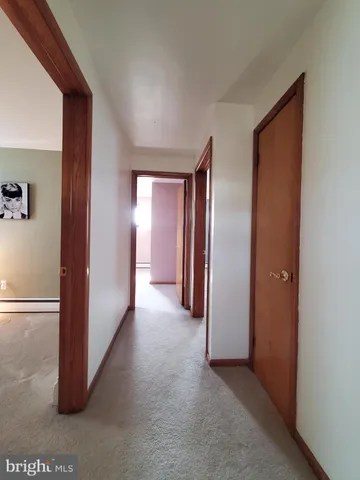 a view of hallway with closet
