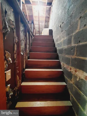 a view of an empty room with a fireplace