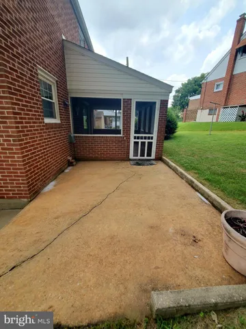 a view of a brick house with a large window