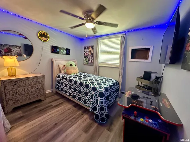 a bedroom with a bed and a dresser