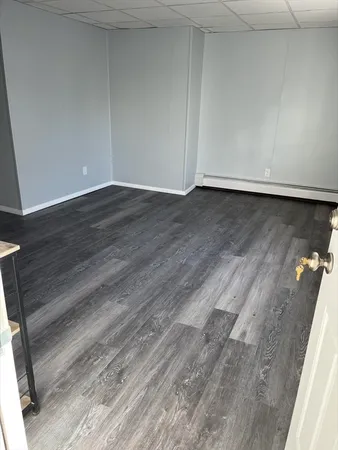 a view of room with wooden floor