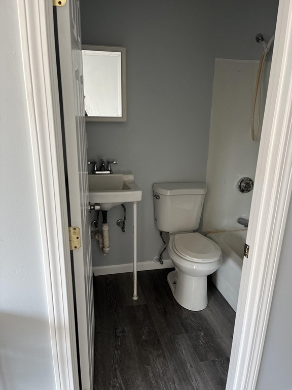 106 Kilburn Street, Unit 1S Fall River, MA 02724 - Photo 6 of 7 a white toilet sitting next to a bathroom sink
