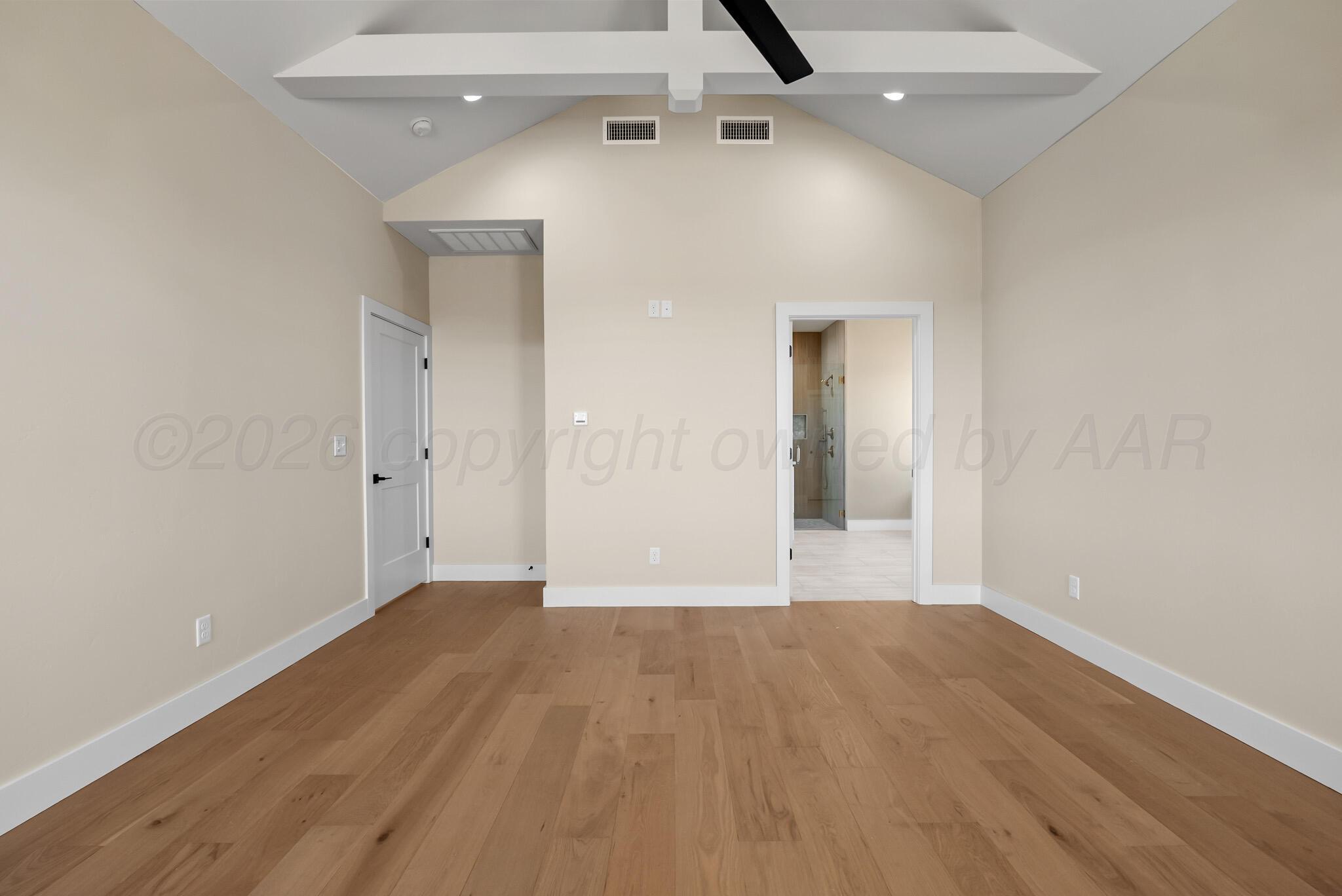 4201 Juniper Springs Road Amarillo, TX 79119 - Photo 21 of 27 wooden floor in an empty room with a window