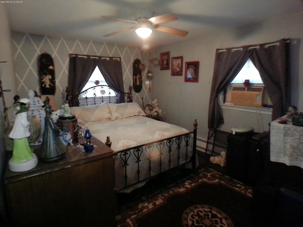 88 Old Farm Road Springfield, MA 01119 - Photo 7 of 16 a bed sitting in a bedroom next to a window