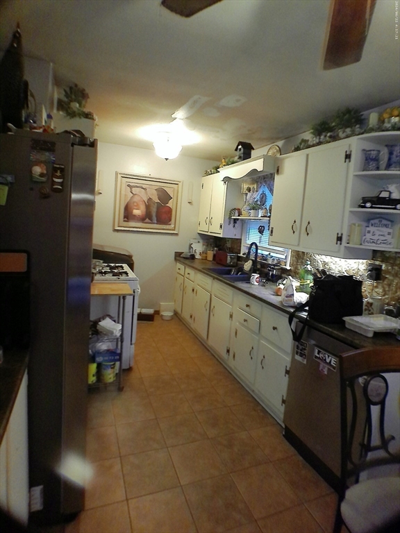 88 Old Farm Road Springfield, MA 01119 - Photo 8 of 16 a kitchen with stainless steel appliances a stove a sink and a refrigerator