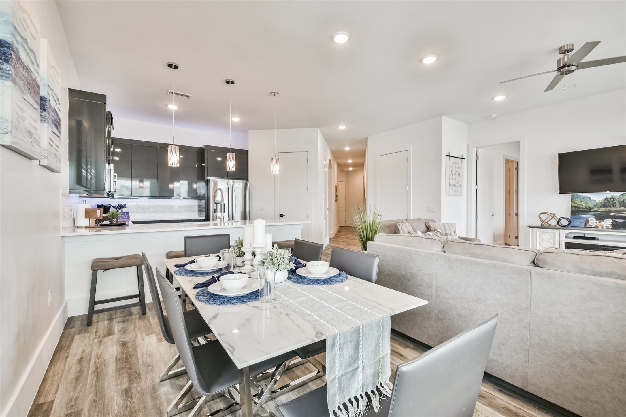 199 Waterpoint Court, Unit 106 Conroe, TX 77304 - Photo 18 of 50 a view of a dining room with furniture