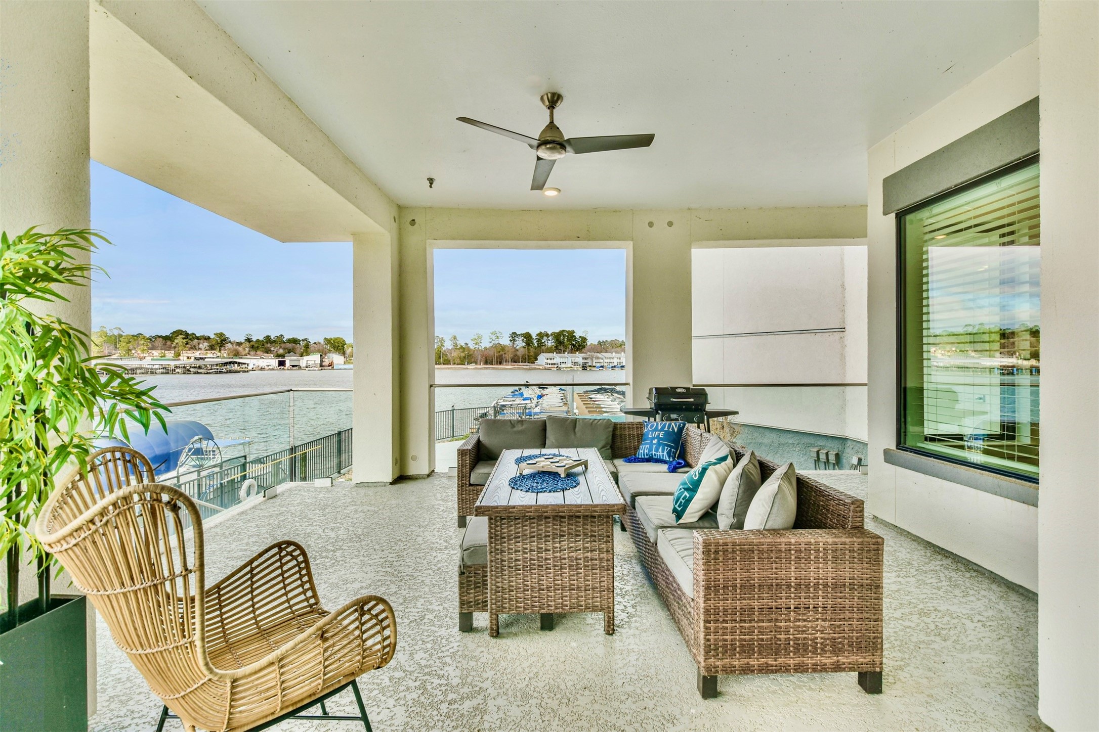 199 Waterpoint Court, Unit 106 Conroe, TX 77304 - Photo 2 of 50 a living room with furniture and a large window