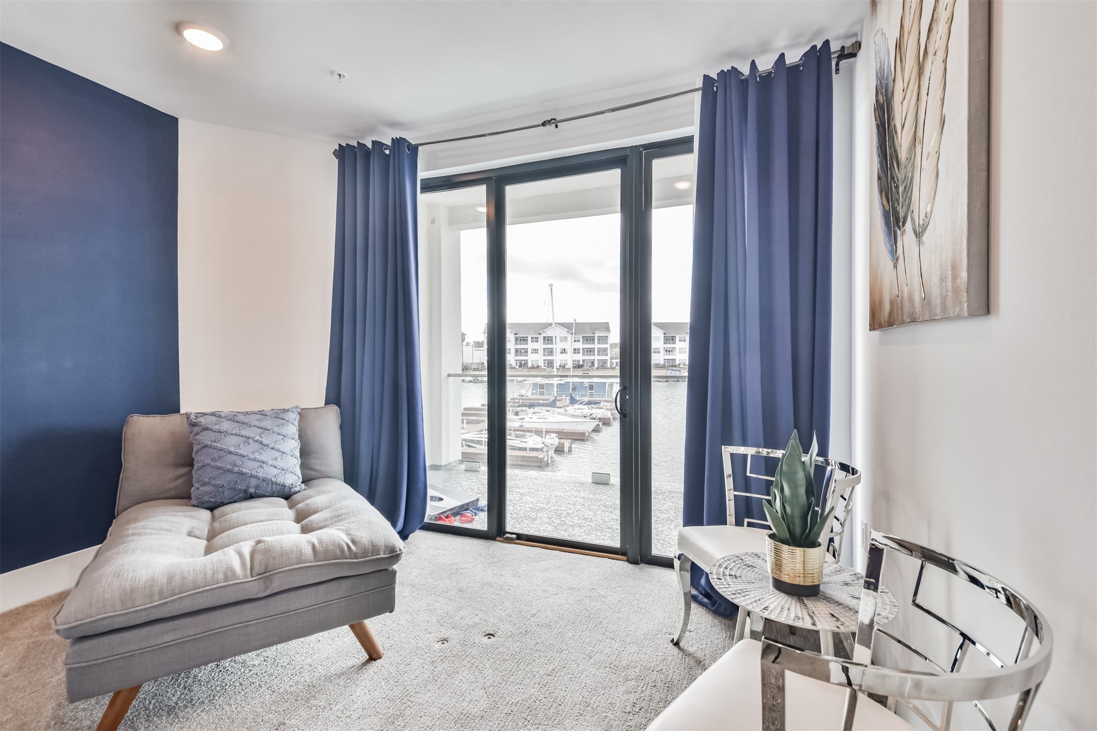 199 Waterpoint Court, Unit 106 Conroe, TX 77304 - Photo 23 of 50 Bedroom large enough to accommodate a seating area--perfect place to read a book while enjoying the lake views.