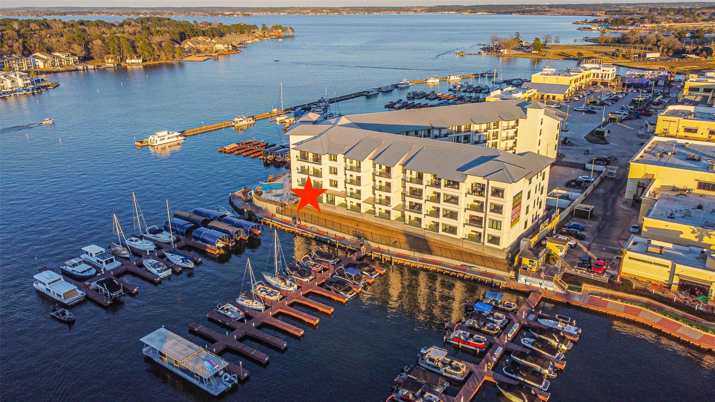 199 Waterpoint Court, Unit 106 Conroe, TX 77304 - Photo 3 of 50 Spectacular views from this corner unit on the first floor of the Shoreline Luxury Condominiums in Lake Conroe.