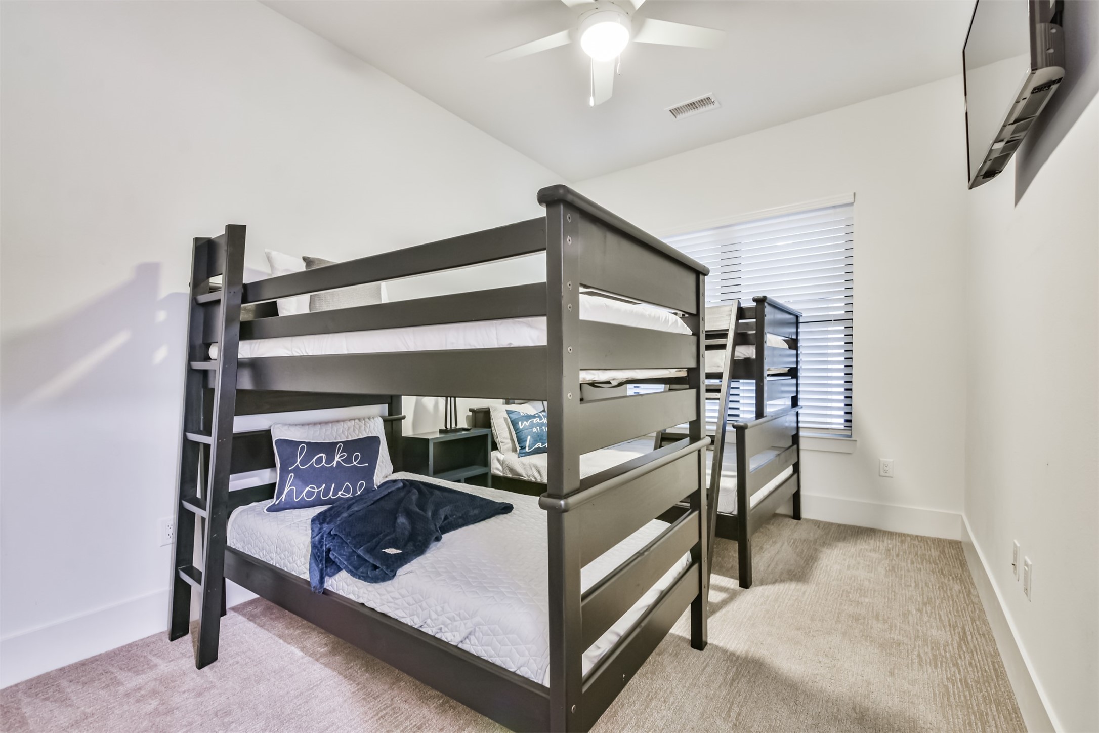 199 Waterpoint Court, Unit 106 Conroe, TX 77304 - Photo 31 of 50 a view of staircase with a rug and a window