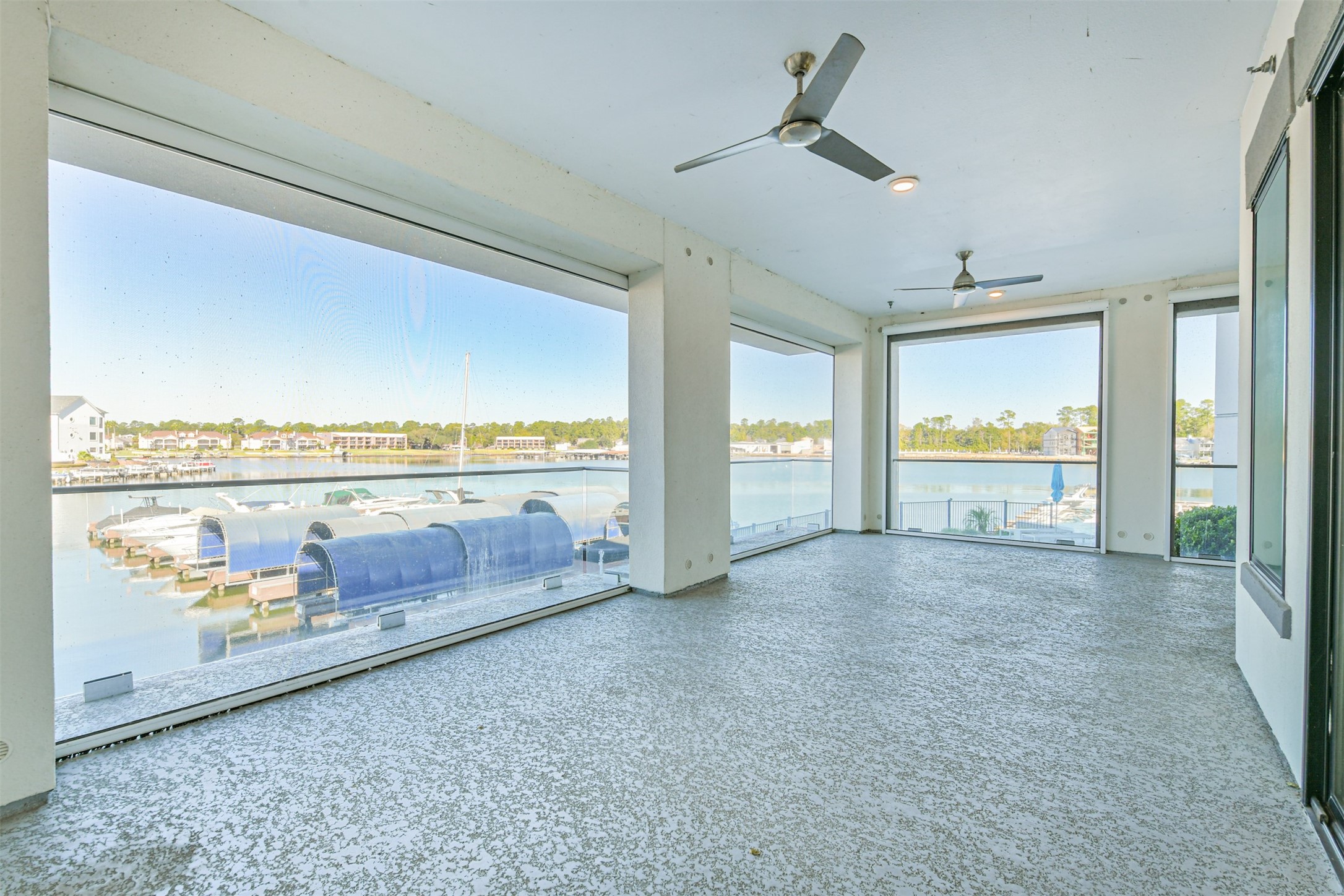 199 Waterpoint Court, Unit 106 Conroe, TX 77304 - Photo 35 of 50 a view of hallway with furniture and floor to ceiling window