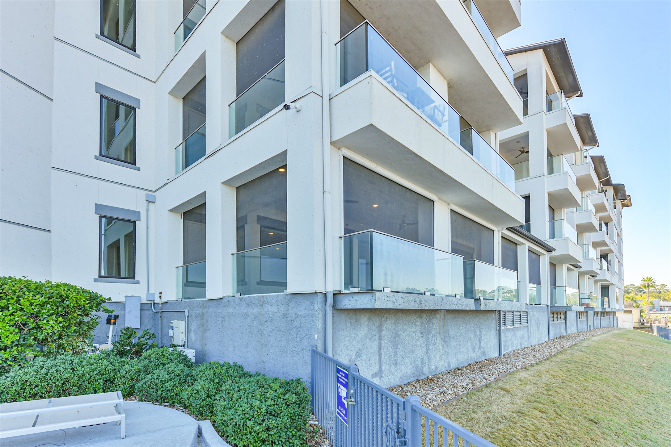 199 Waterpoint Court, Unit 106 Conroe, TX 77304 - Photo 41 of 50 This first floor corner unit has the best views and location in the building--note the privacy the motorized shades provide.