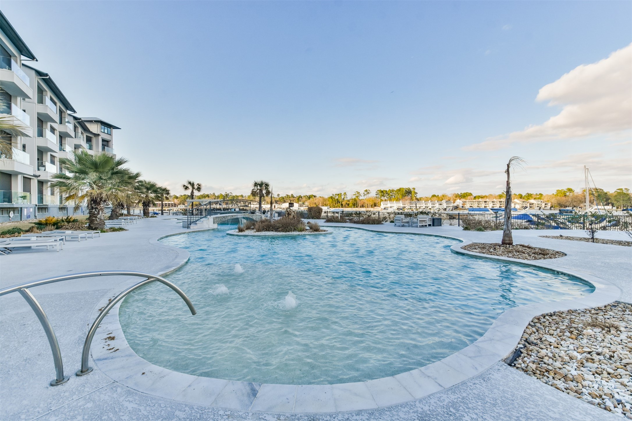 199 Waterpoint Court, Unit 106 Conroe, TX 77304 - Photo 44 of 50 a view of a swimming pool with a yard