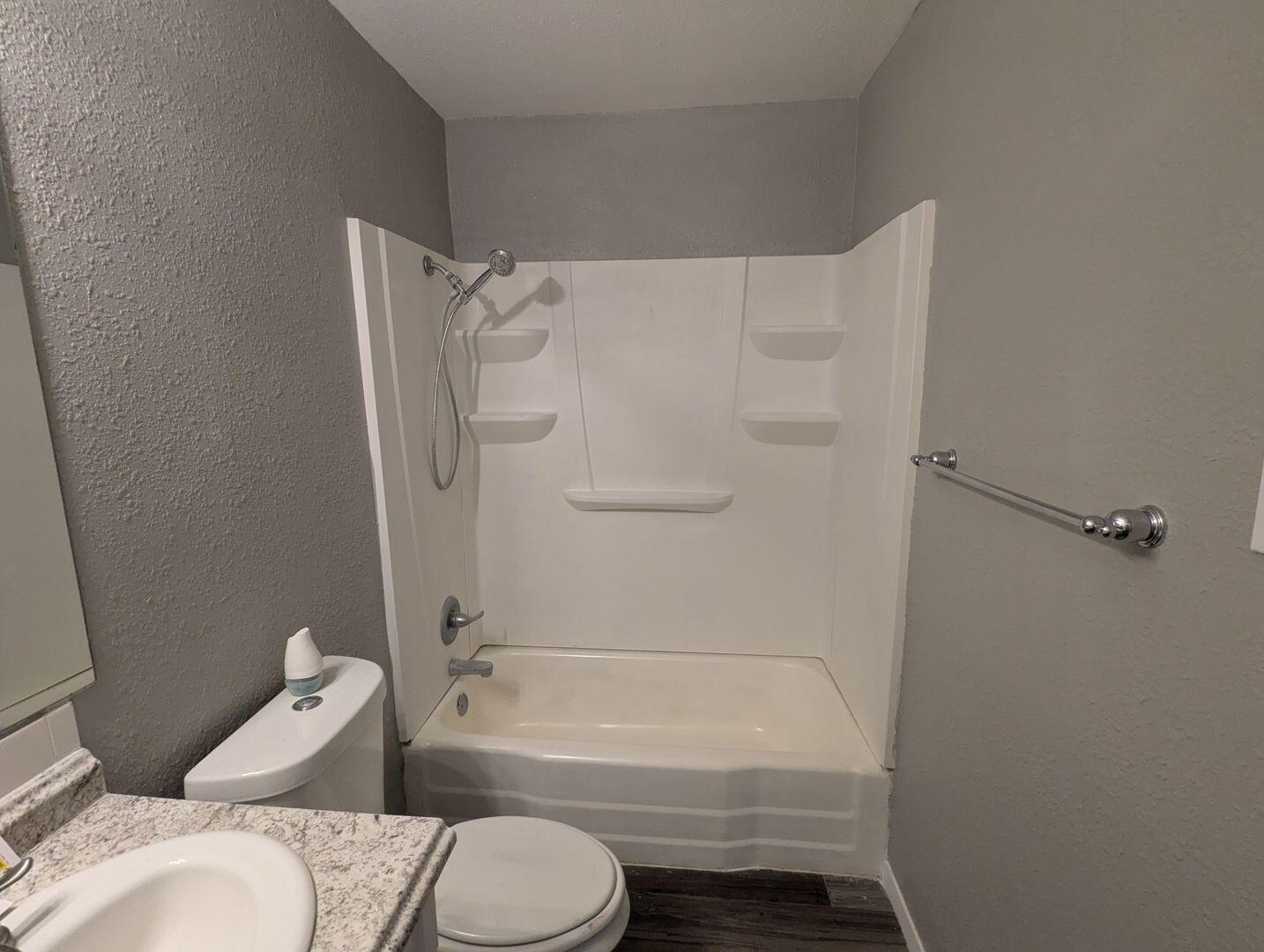 535 42nd Street, Unit A & B Lubbock, TX 79404 - Photo 12 of 13 a bathroom with a toilet and a bath tub
